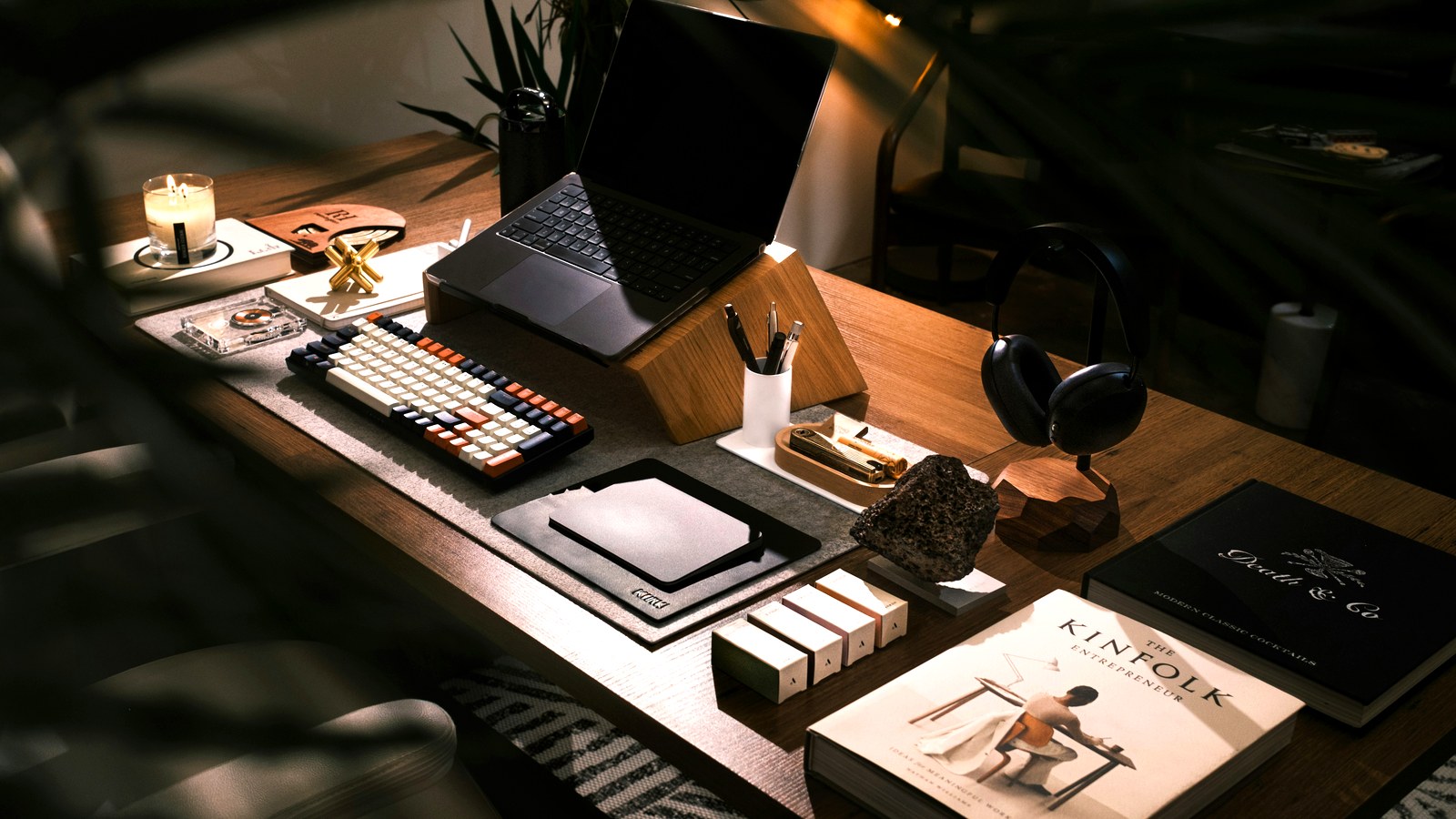 Two people talking across a small table with a notebook open between them